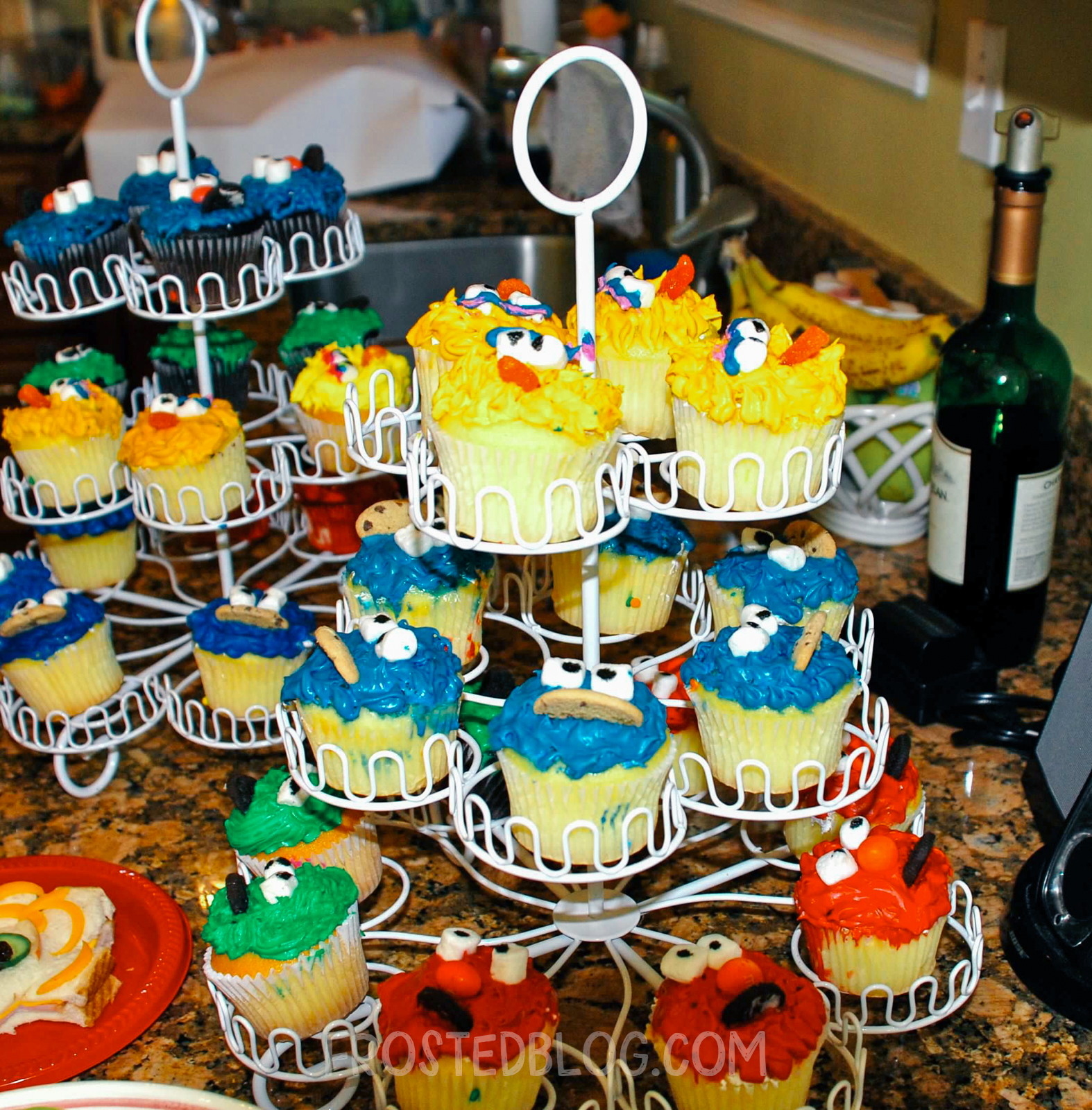 Elmo Birthday party by frostedevents  Sesame Street cupcakes